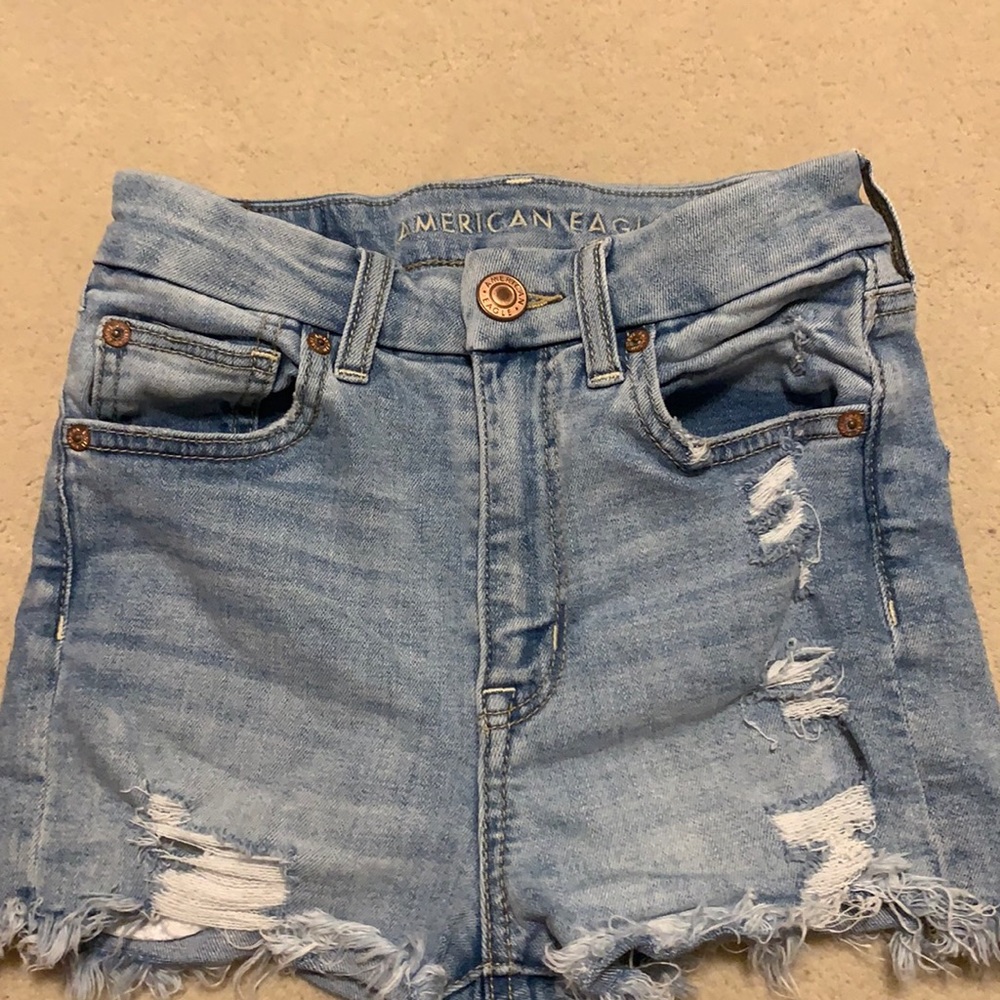 blue ripped jean shorts